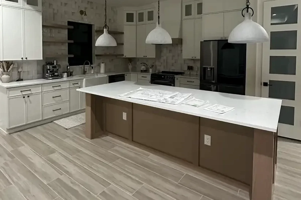 Sarasota finished flooring example: Kitchen floors should meet cabinetry and adjoining rooms with controlled, professional details.