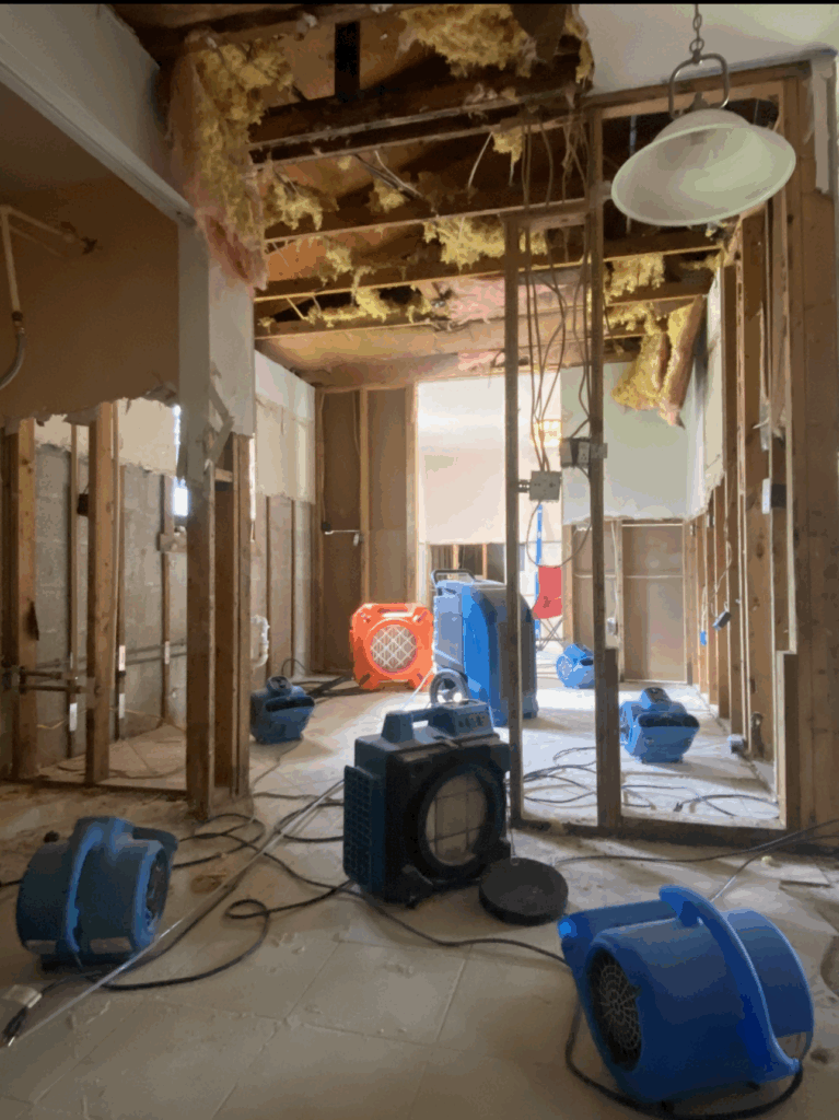 Damage restoration team repairing water and fire damage in a North Port, FL home