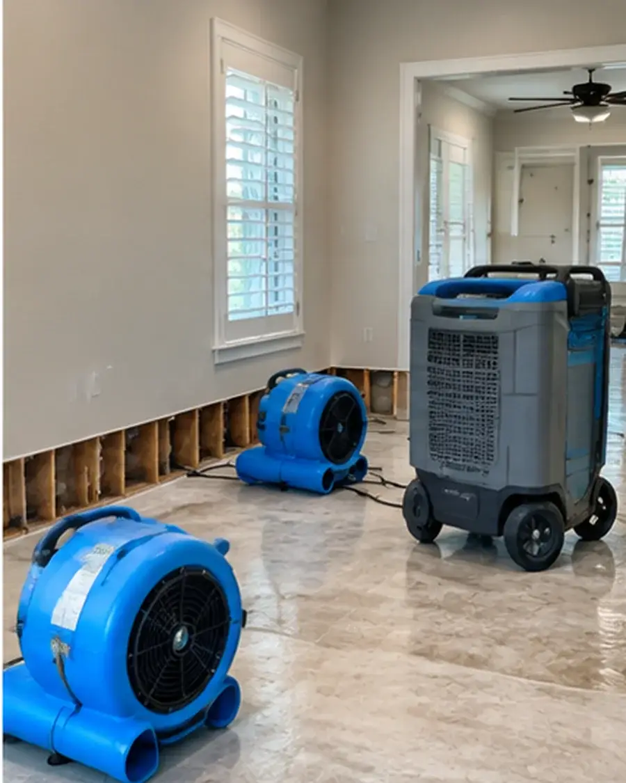 Air movers and dehumidification equipment stabilizing a wet interior